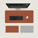 Shappa Dual-Sided Desk Mat in brown, shown with a keyboard and mouse plus the brown and grey colour options
