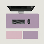 Shappa Dual-Sided Desk Mat in purple, shown with a keyboard and mouse plus the pink and purple colour options