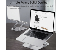 Shappa Laptop Stand Riser holding a MacBook on a wood desk, with a second stand and laptop in the background