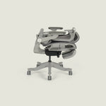 Smile foldable ergonomic chair in folded position - saves 57% space, compact storage for small apartments and home offices