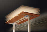 Shappa MO2 electric standing desk frame in motion, showing smooth dual motor height adjustment with anti-collision sensors on the oval tube legs