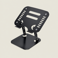 Black adjustable laptop stand with a ventilated metal platform, non-slip pads and a stable base for ergonomic desk use.