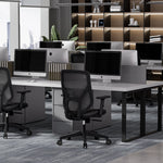 A19 black desk chair in open plan corporate office workspace setting