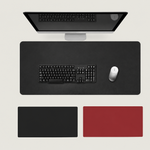 Shappa Dual-Sided Desk Mat in black, shown with a keyboard and mouse plus the black and red colour options