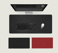 Shappa Dual-Sided Desk Mat in black, shown with a keyboard and mouse plus the black and red colour options