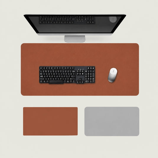 Shappa Dual-Sided Desk Mat in brown, shown with a keyboard and mouse plus the brown and grey colour options