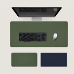 Shappa Dual-Sided Desk Mat in green, shown with a keyboard and mouse plus the green and navy colour options
