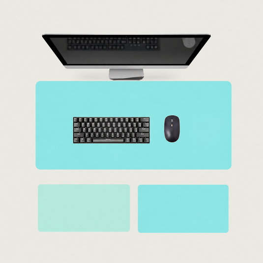 Shappa Dual-Sided Desk Mat in turquoise, shown with a keyboard and mouse plus the light green and lake blue colour options