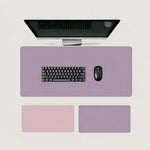 Shappa Dual-Sided Desk Mat in purple, shown with a keyboard and mouse plus the pink and purple colour options
