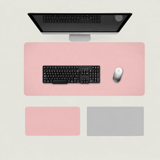 Shappa Dual-Sided Desk Mat in pink, shown with a keyboard and mouse plus the pink and silver grey colour options