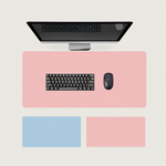 Shappa Dual-Sided Desk Mat in pink, shown with a keyboard and mouse plus the pink and sky blue colour options