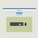 Matcha Green keypad mat with a keyboard and mouse placed on top