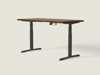 Shappa MO2 electric standing desk with walnut tabletop and black frame - dual motor oval tube angled studio shot