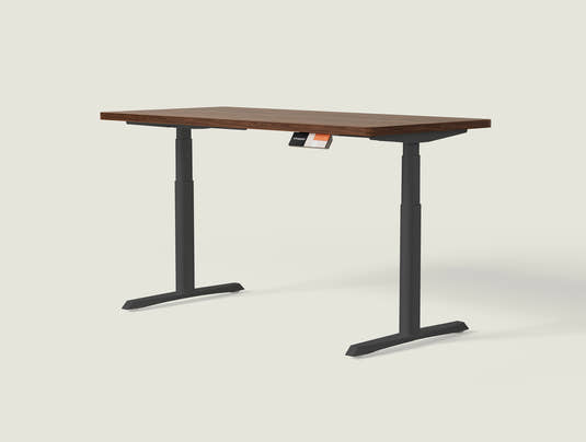 Shappa MO2 electric standing desk with walnut tabletop and black frame - dual motor oval tube angled studio shot