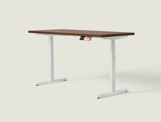 Shappa MO2 electric standing desk with walnut tabletop and white frame - dual motor oval tube angled studio shot