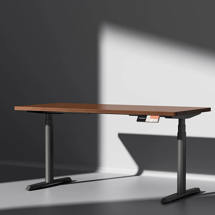 Shappa MO2 electric standing desk with walnut tabletop and black frame - dual motor oval tube angled studio shot