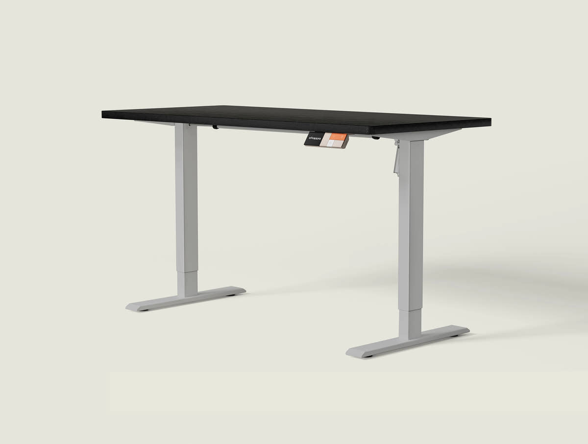Shappa MS1 electric standing desk with black tabletop and grey frame - single motor angled studio shot