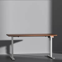 Shappa MS1 electric standing desk with walnut tabletop and white frame - front angle studio shot