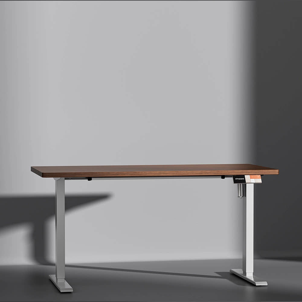 Shappa MS1 electric standing desk with walnut tabletop and white frame - front angle studio shot