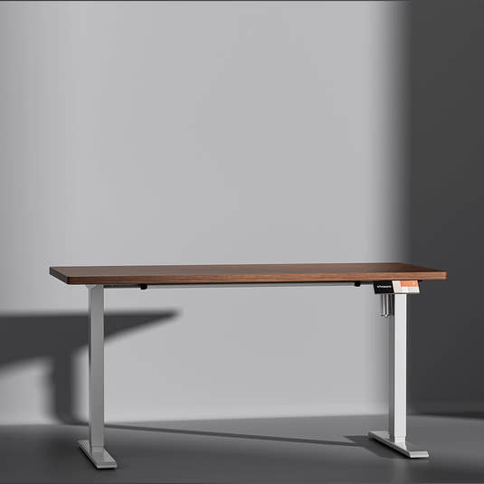 Shappa MS1 electric standing desk with walnut tabletop and white frame - front angle studio shot