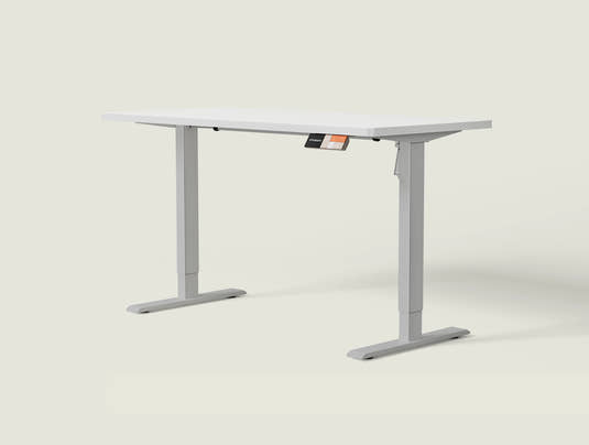Shappa MS1 electric standing desk with white tabletop and grey frame - single motor angled studio shot
