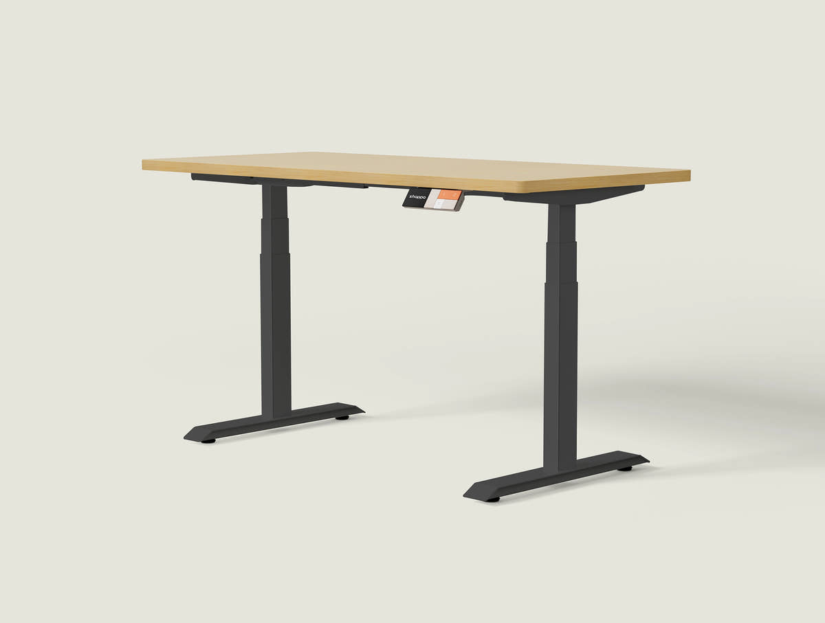 Shappa MS2 electric standing desk with light walnut tabletop and black frame - dual motor square tube angled studio shot