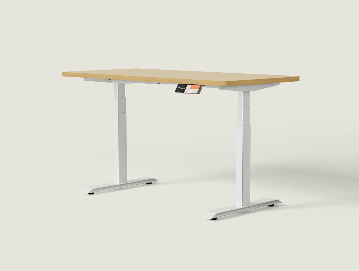 Shappa MS2 electric standing desk with light walnut tabletop and white frame - dual motor square tube angled studio shot
