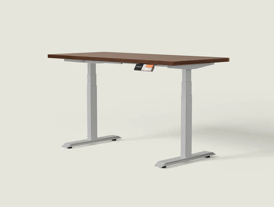 Shappa MS2 electric standing desk with walnut tabletop and grey frame - dual motor square tube angled studio shot