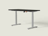 Shappa MS2 electric standing desk with black tabletop and grey frame - dual motor square tube angled studio shot