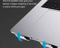 Shappa Laptop Stand Riser silicone-padded clips gripping the edge of a laptop to prevent slipping