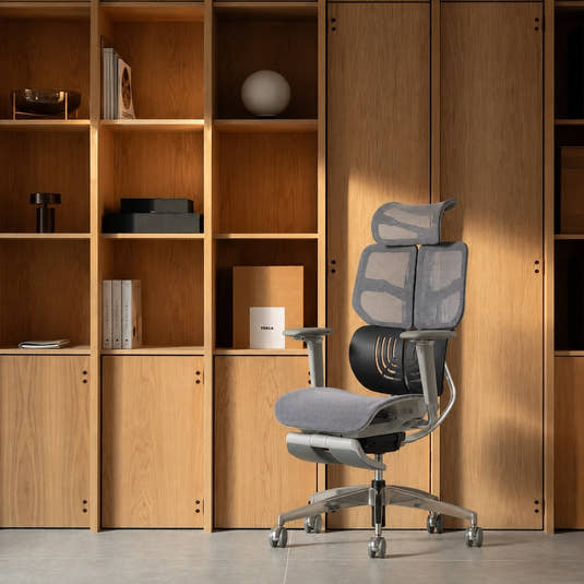 Shappa Spencer high back ergonomic desk chair for home office, grey mesh with timber shelving background
