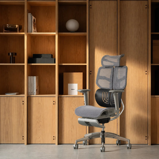 Shappa Spencer high back ergonomic desk chair for home office, grey mesh with timber shelving background
