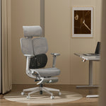 Shappa Spencer high back ergonomic office chair with headrest beside a standing desk in a home office
