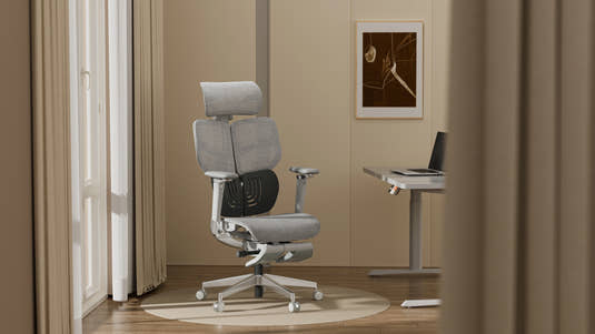 Shappa Spencer high back ergonomic office chair with headrest beside a standing desk in a home office
