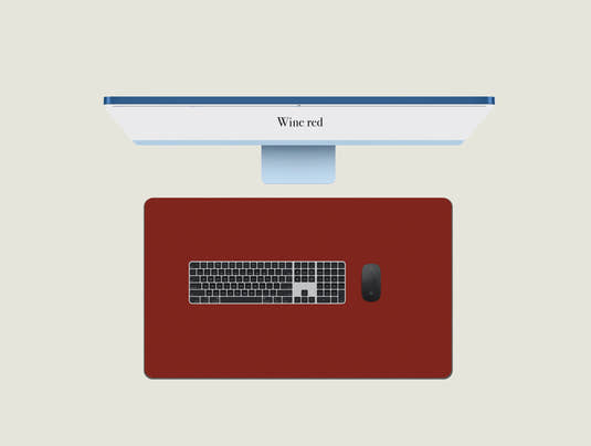Wine Red leather mouse pad with a keyboard and mouse placed on top
