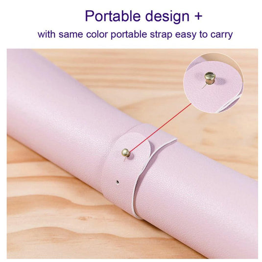 Dual-sided desk mat rolled up with a matching-colour strap, showing its portable, easy-to-carry design